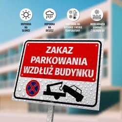 Tabliczka: zakaz parkowania wzdłuż budynku